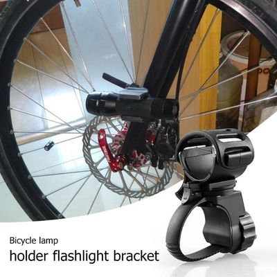 Clampada de clip de luz delantera giratorio de 360 grados para bicicleta Construcción ABS de caucho negro
